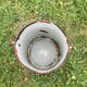 Old milk pot in enamelled sheet metal