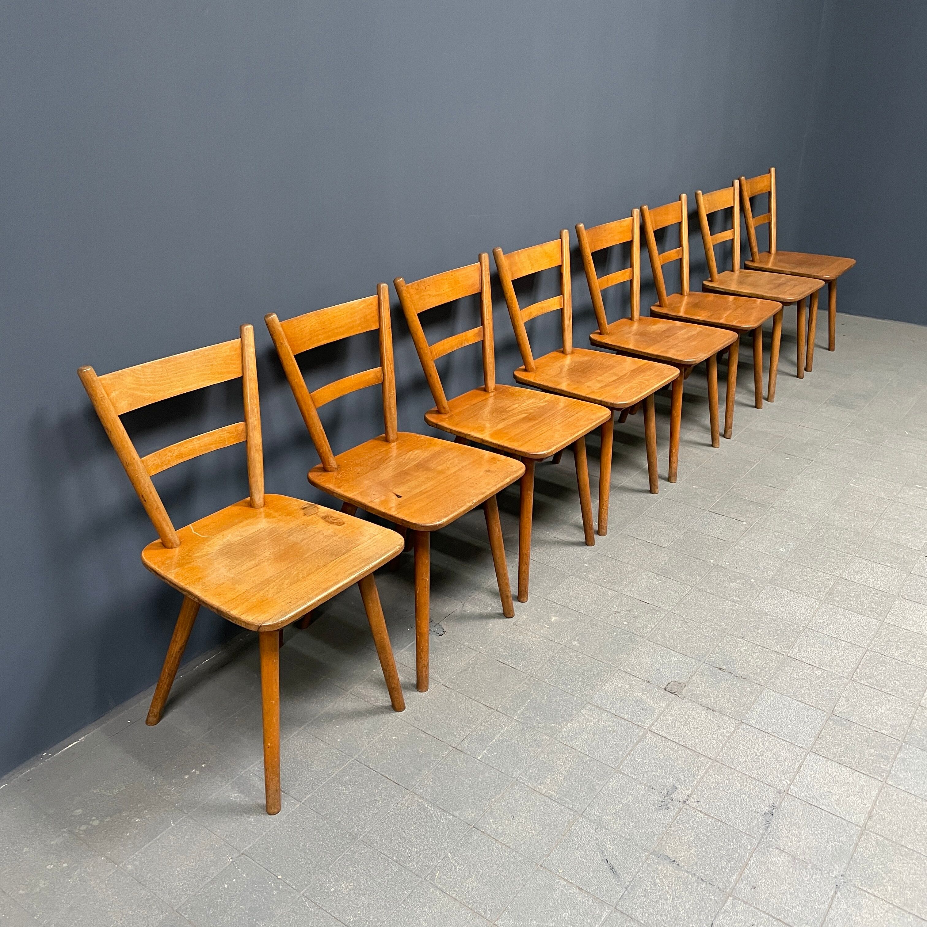 Set of eight german stick chairs from the 1950
