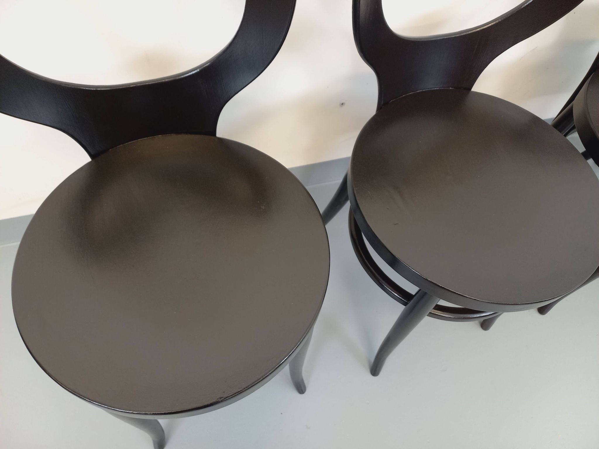 Set of 4 vintage Mouette chairs by Baumann in black wood from the 1960s.