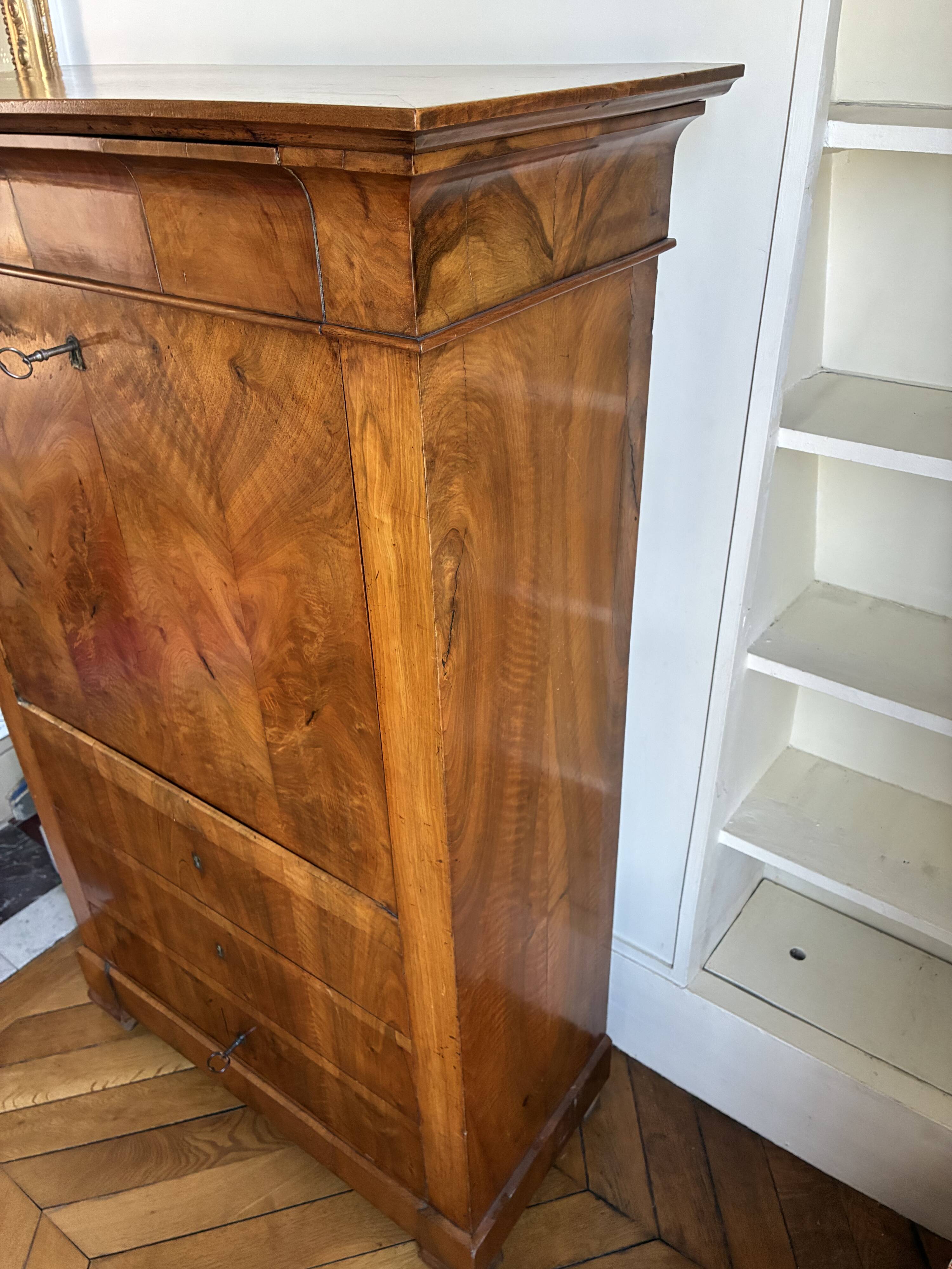 Secretary in "Louis Philippe style, Biedermeier influence" in walnut.