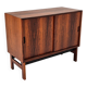 Low sideboard in rosewood with sliding doors. Denmark, 1960s