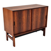 Low sideboard in rosewood with sliding doors. Denmark, 1960s