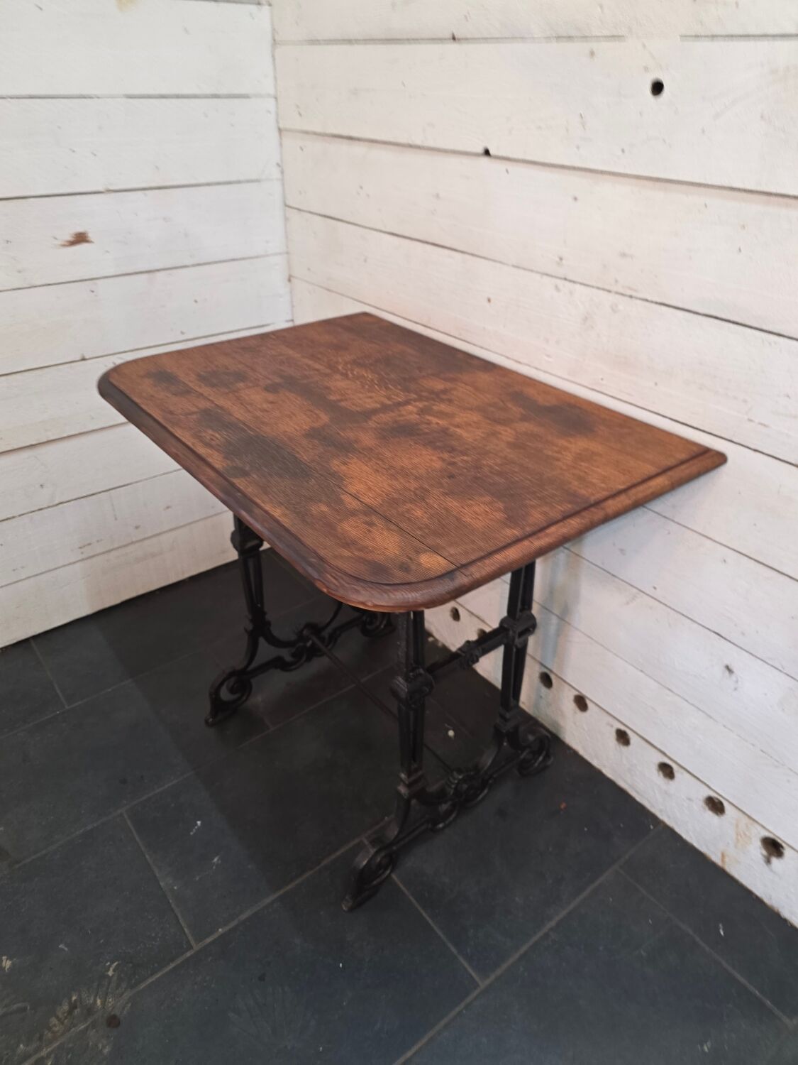 Bistro table with cast iron legs and oak top
