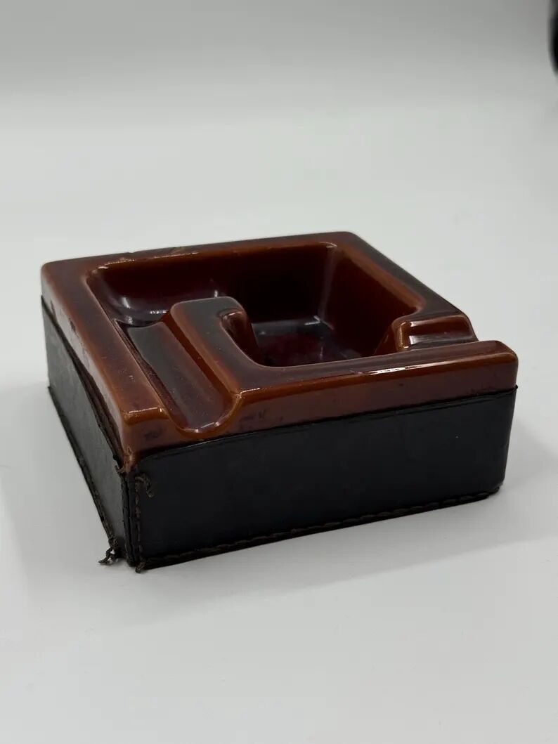 Geometric brown enamelled ashtray with a leather base (1960s-70s)