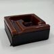 Geometric brown enamelled ashtray with a leather base (1960s-70s)