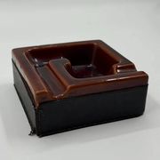 Geometric brown enamelled ashtray with a leather base (1960s-70s)