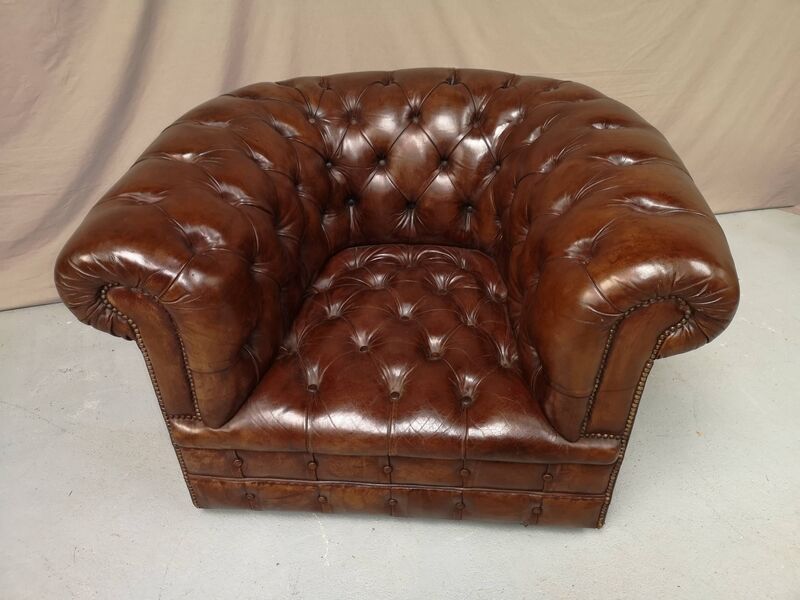 Padded Brown chesterfield armchair