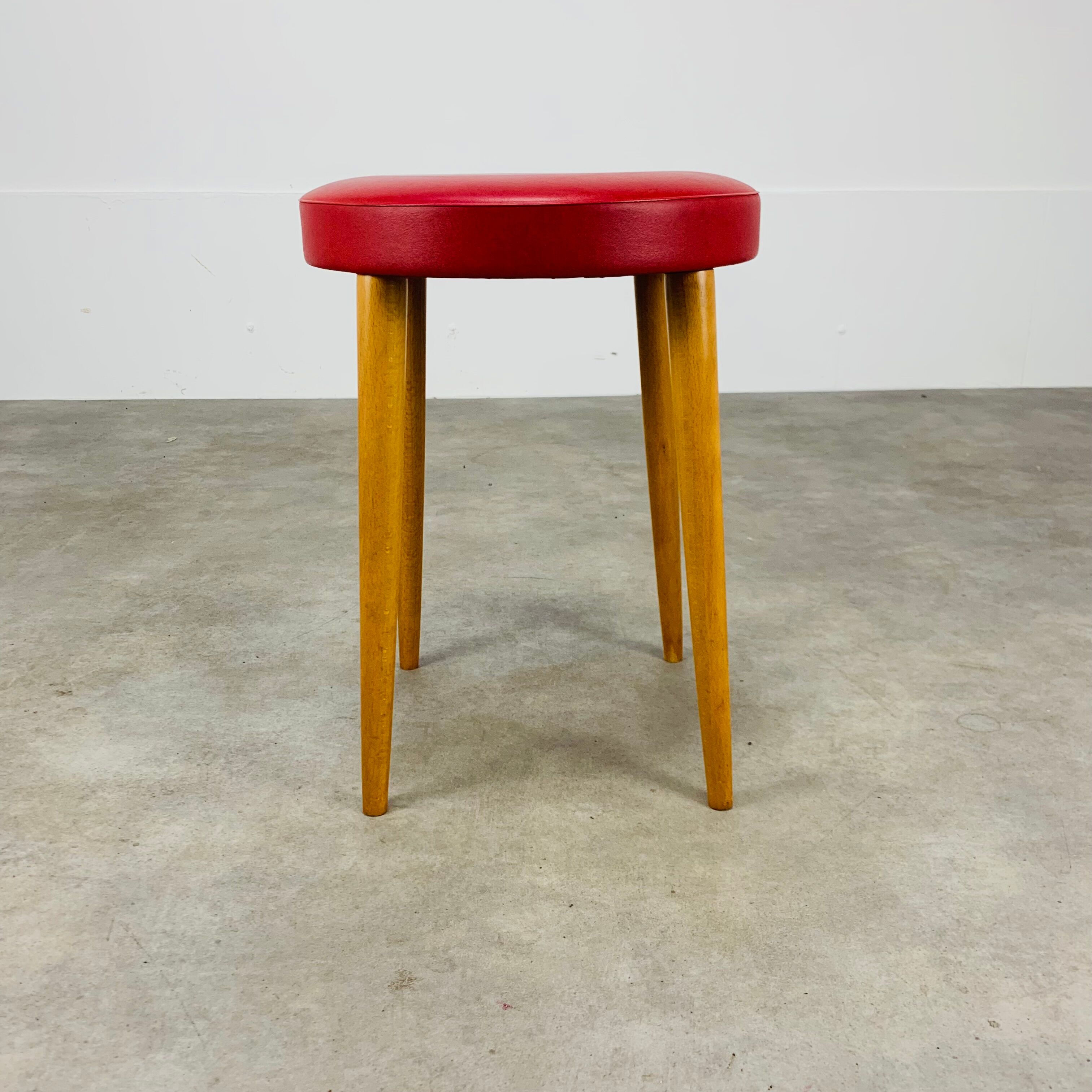 Baumann bistro stool wood and imitation red leather 60s