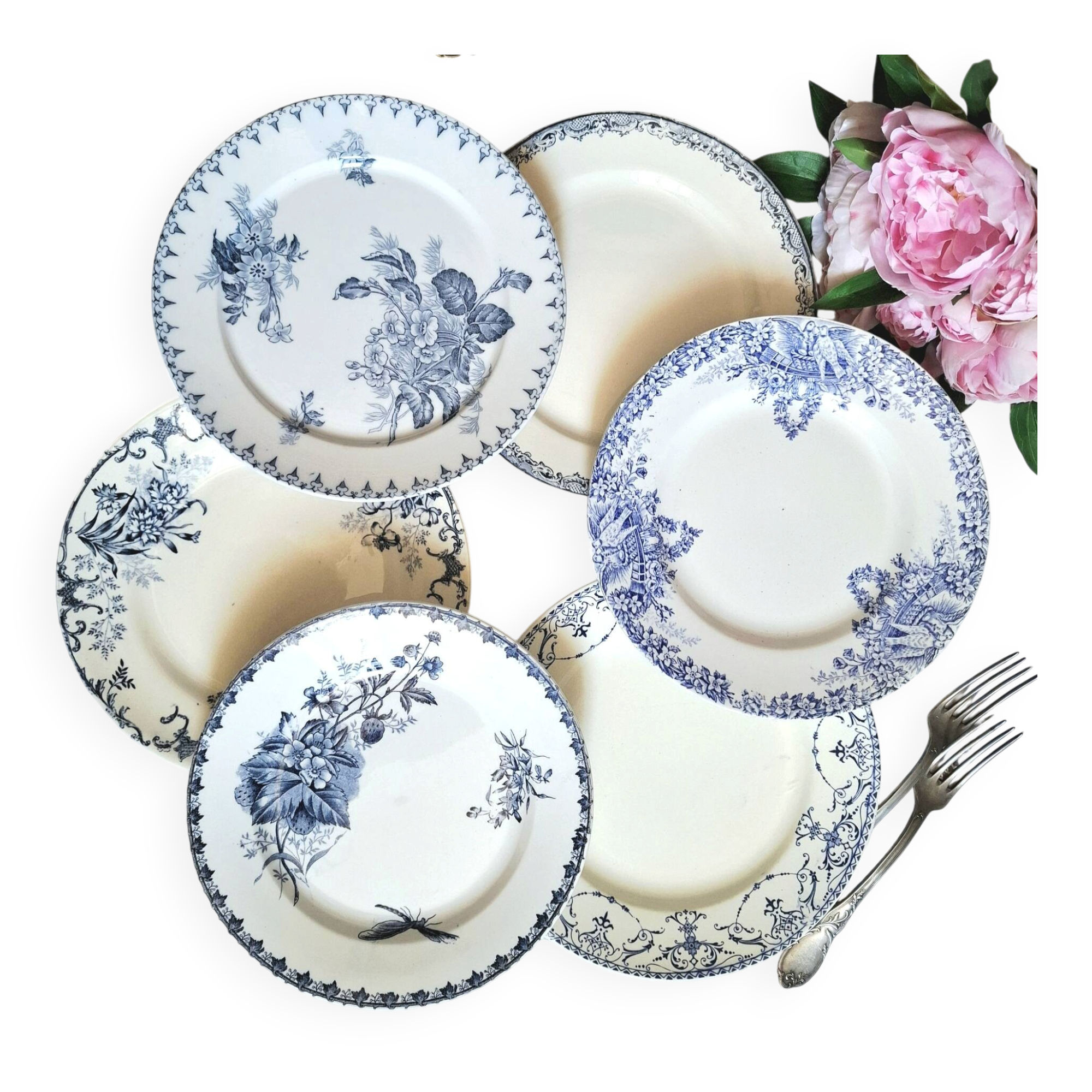 Old mismatched flat plates made of ironstone earthenware.
