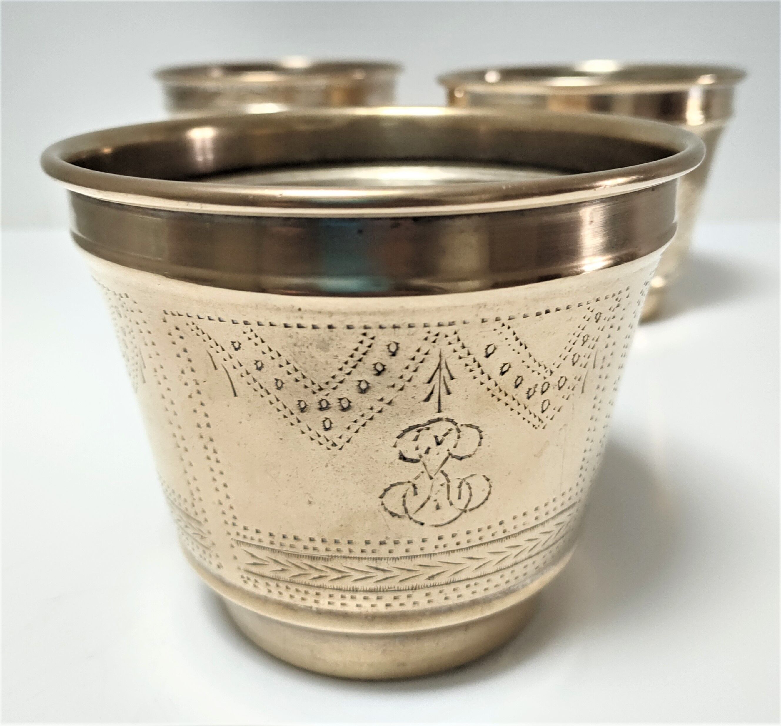 Three pot covers brass silver cover golden patina monogram early twentieth century
