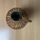 Dame jean covered in woven wicker