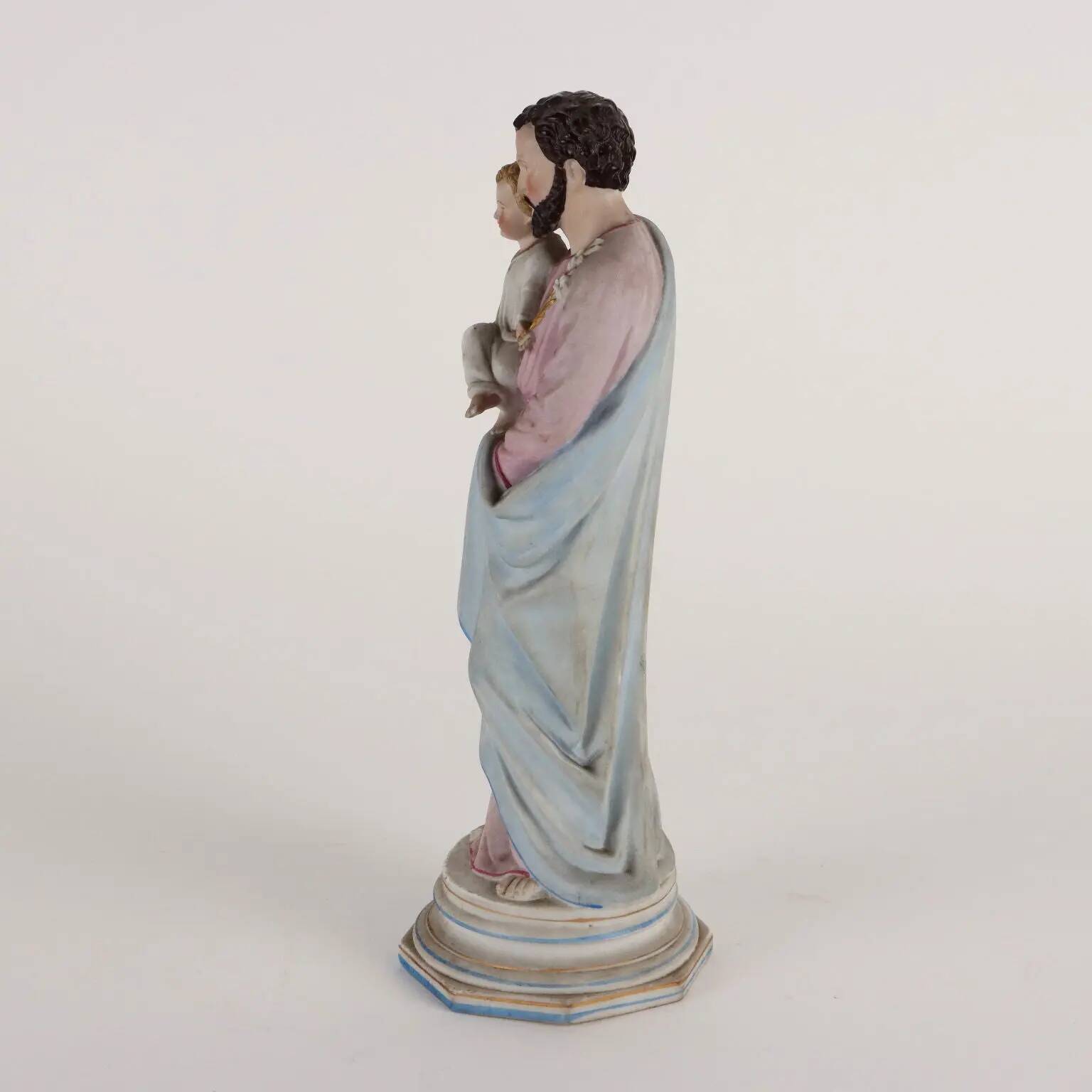 Ancient sculpture of Saint Joseph in a display case, Italy 1900s, polychrome porcelain.