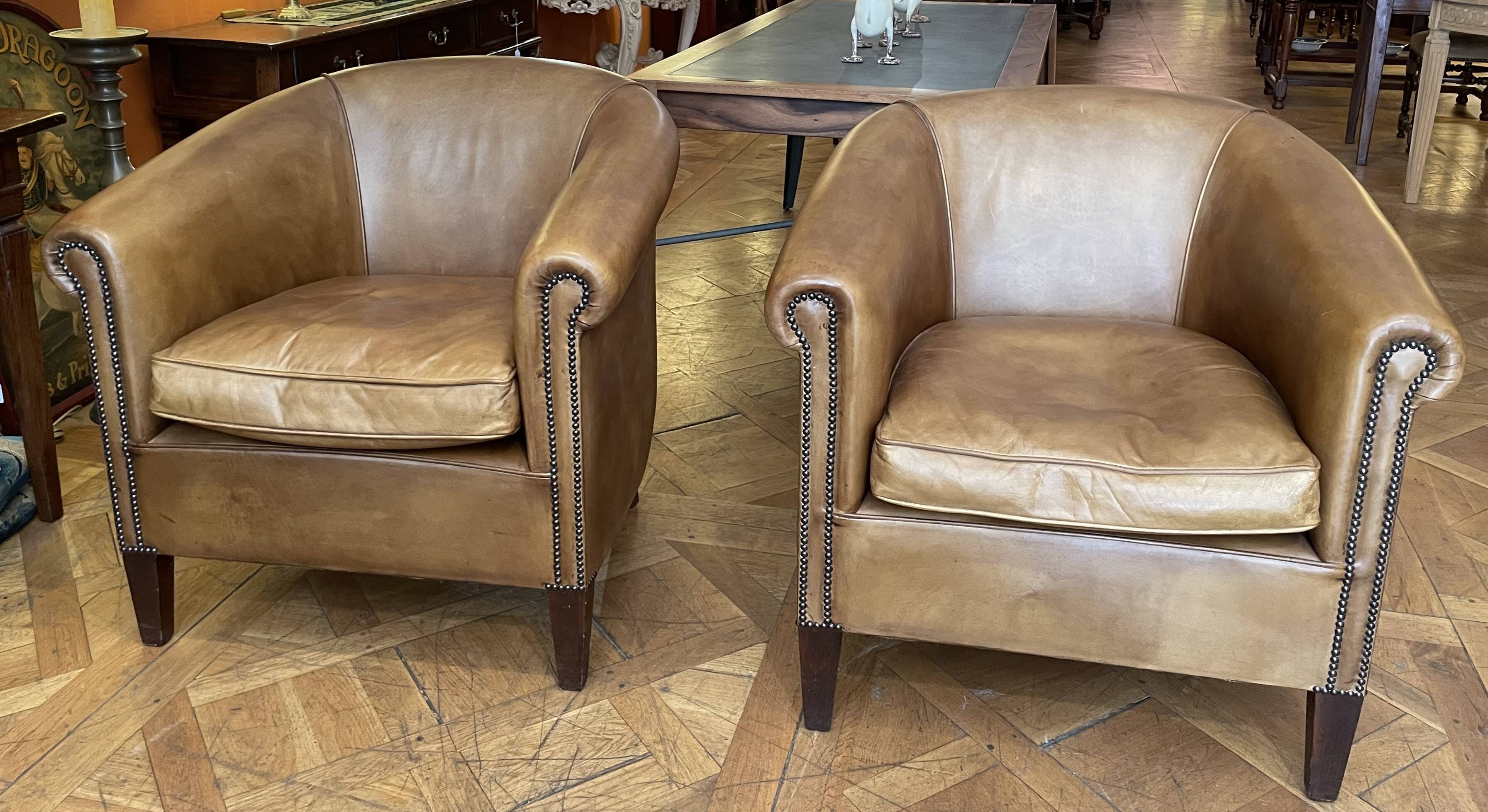 pair of camel leather club armchairs