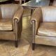 pair of camel leather club armchairs