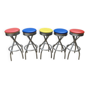 Set of 5 vintage swivel bar stools in blue, red, orange, and yellow.