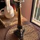 Empire candlestick in gilded and patinated bronze, decorated with acanthus leaves and griffins.