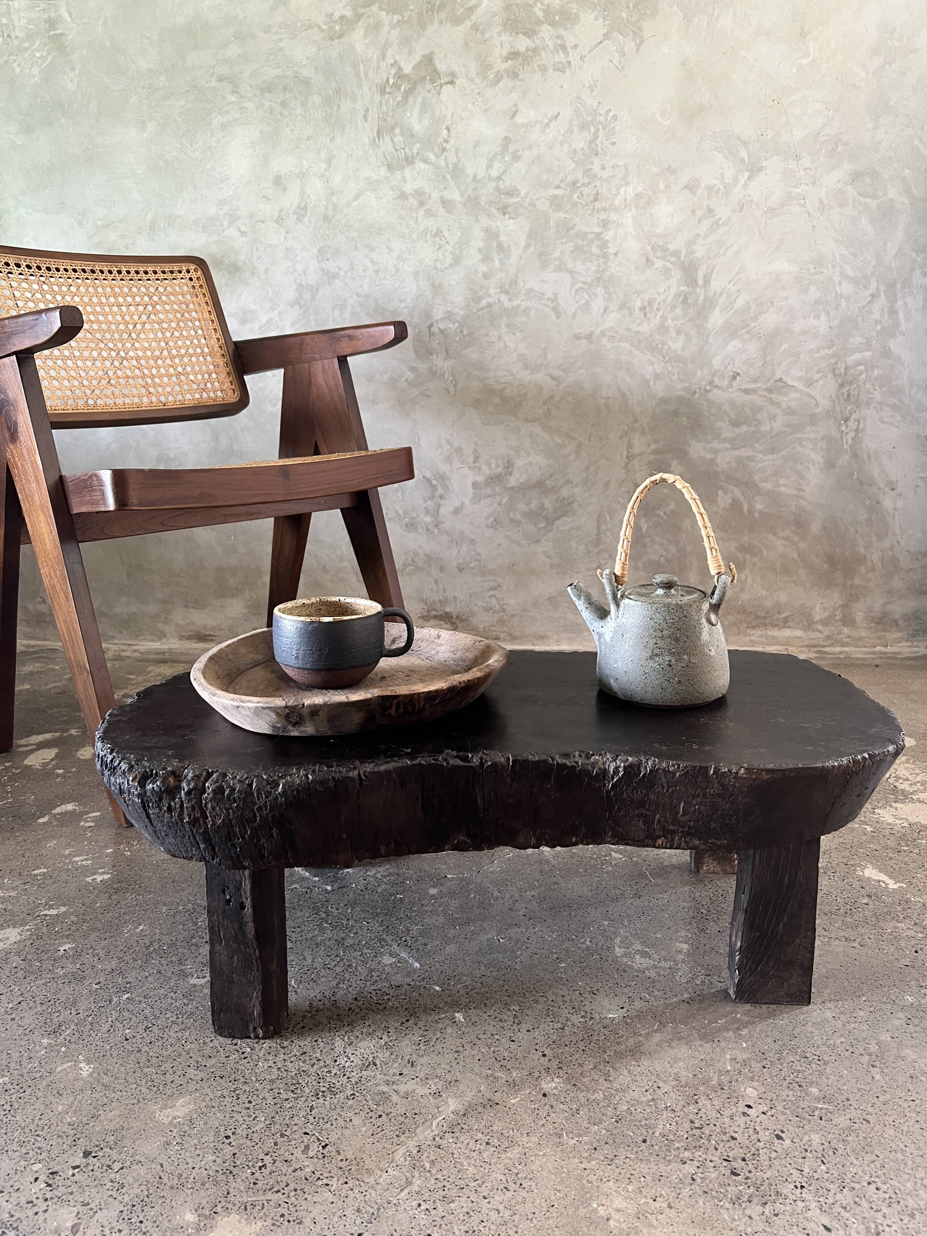Small old Asian wooden coffee table in Japanese style, kidney-shaped top