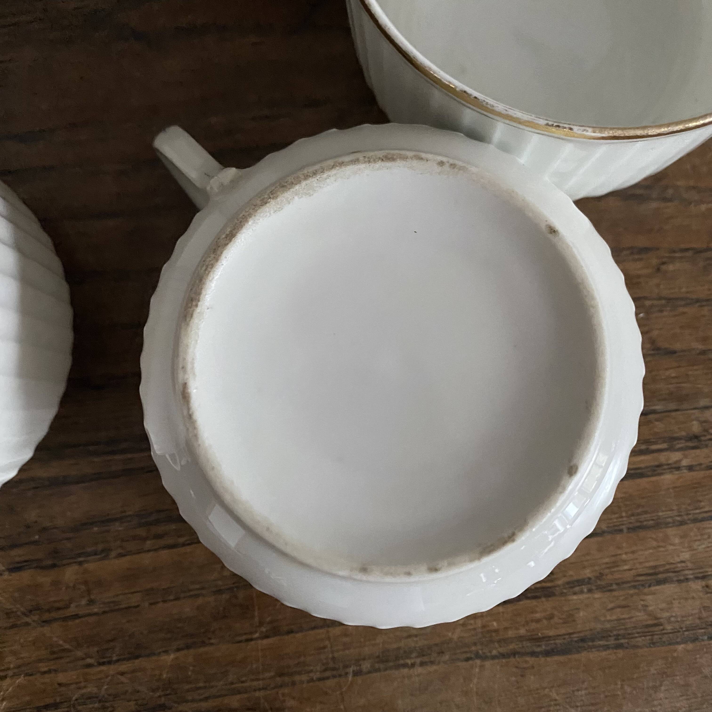 White and gold porcelain cups