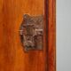 Vintage walnut wardrobe with exposed hardware.