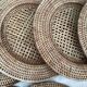 Set of round woven rattan and canework coasters