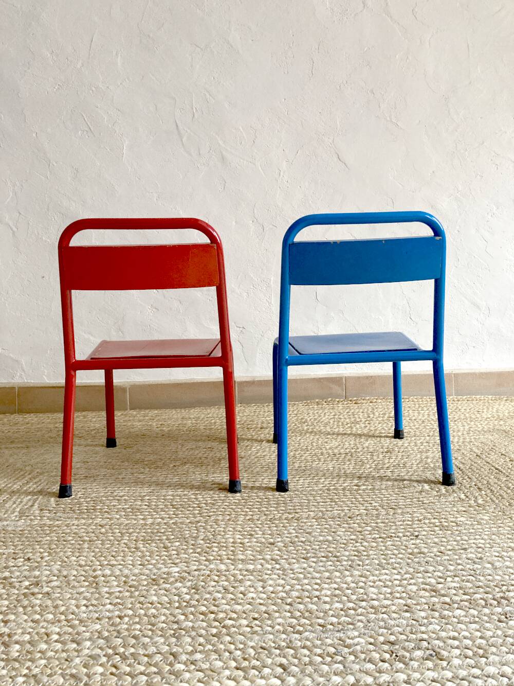 Pair of Mullca nursery chairs in metal and wood painted red and blue