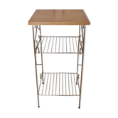 Side table with a golden magazine holder