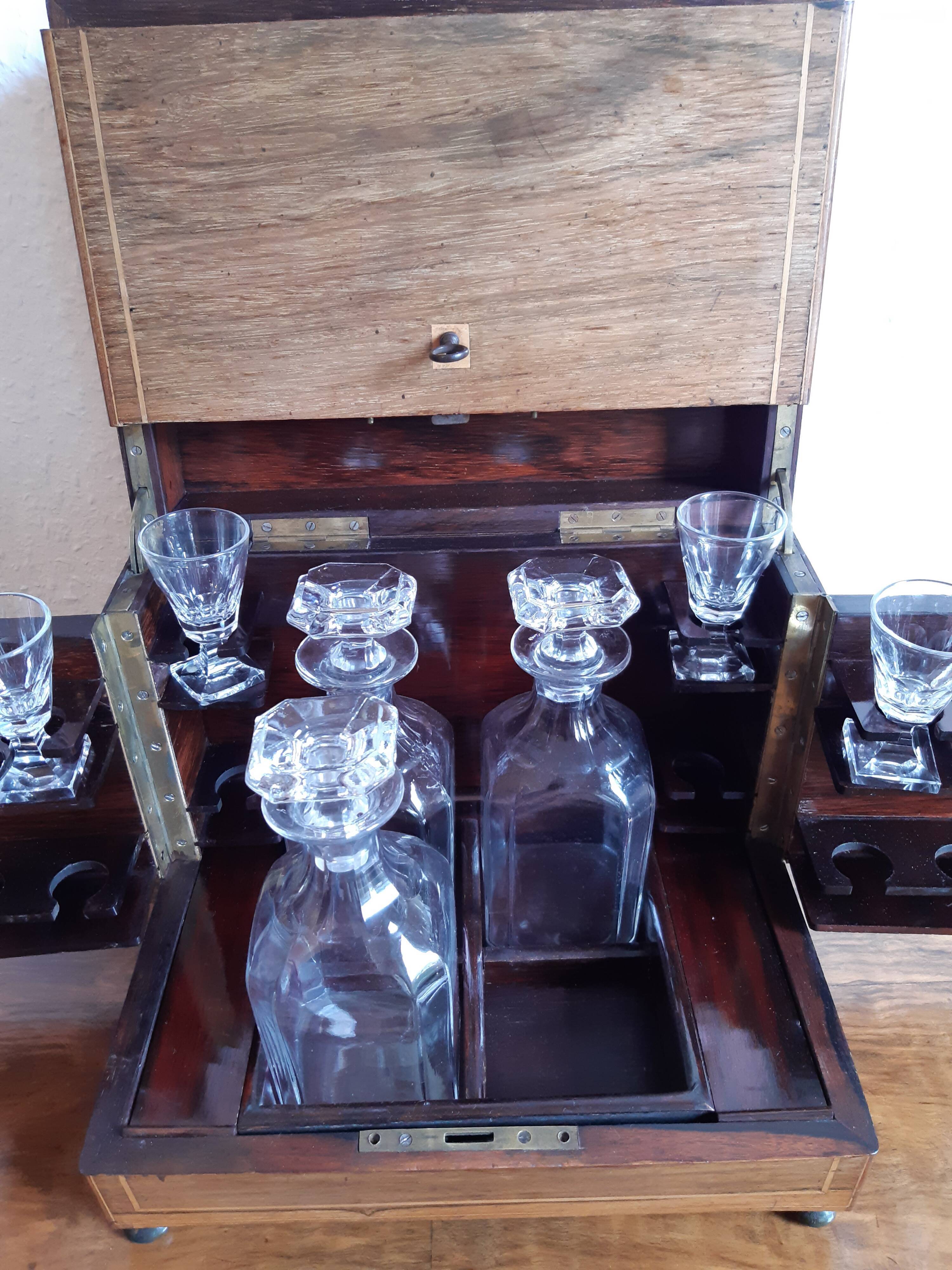 Old-fashioned glass liquor cellar and St Louis crystal decanters