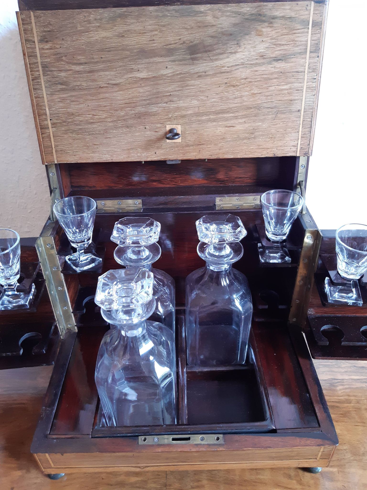 Old-fashioned glass liquor cellar and St Louis crystal decanters