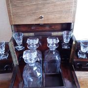 Old-fashioned glass liquor cellar and St Louis crystal decanters