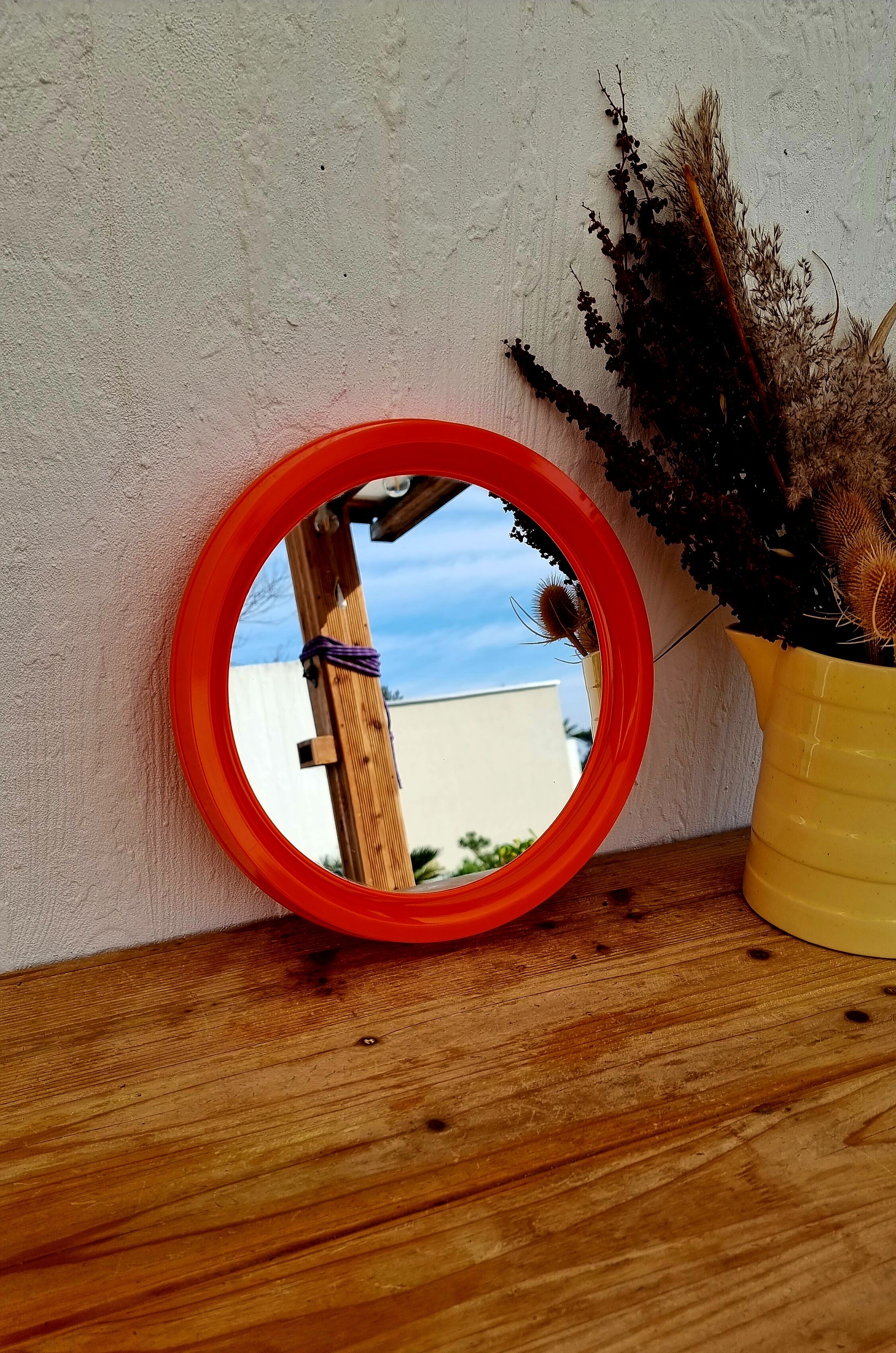 Vintage orange round mirror