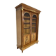Large Empire-style library in wood with gilded bronze ornaments.