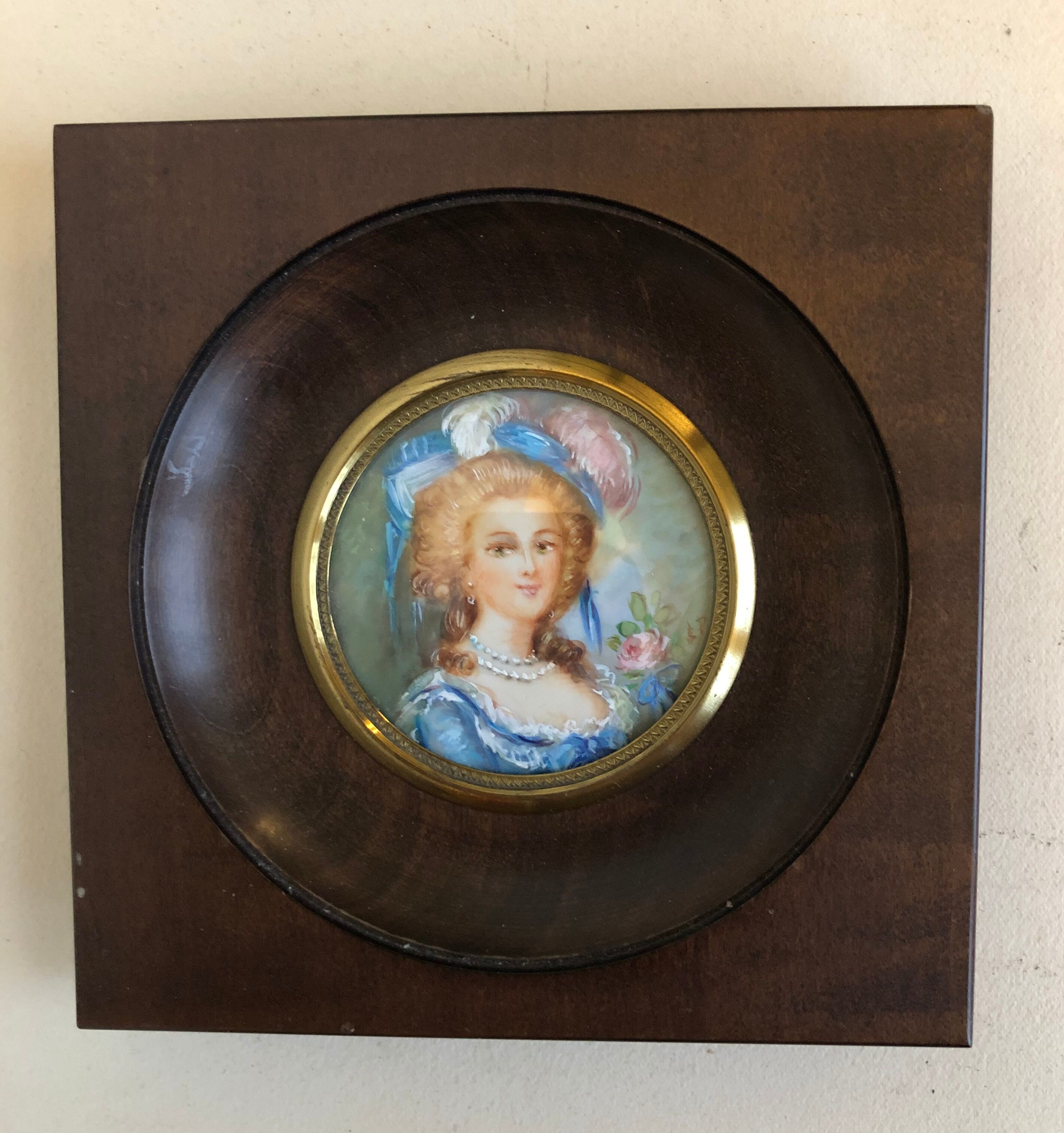 Elegant miniature in blue hat