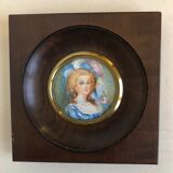 Elegant miniature in blue hat