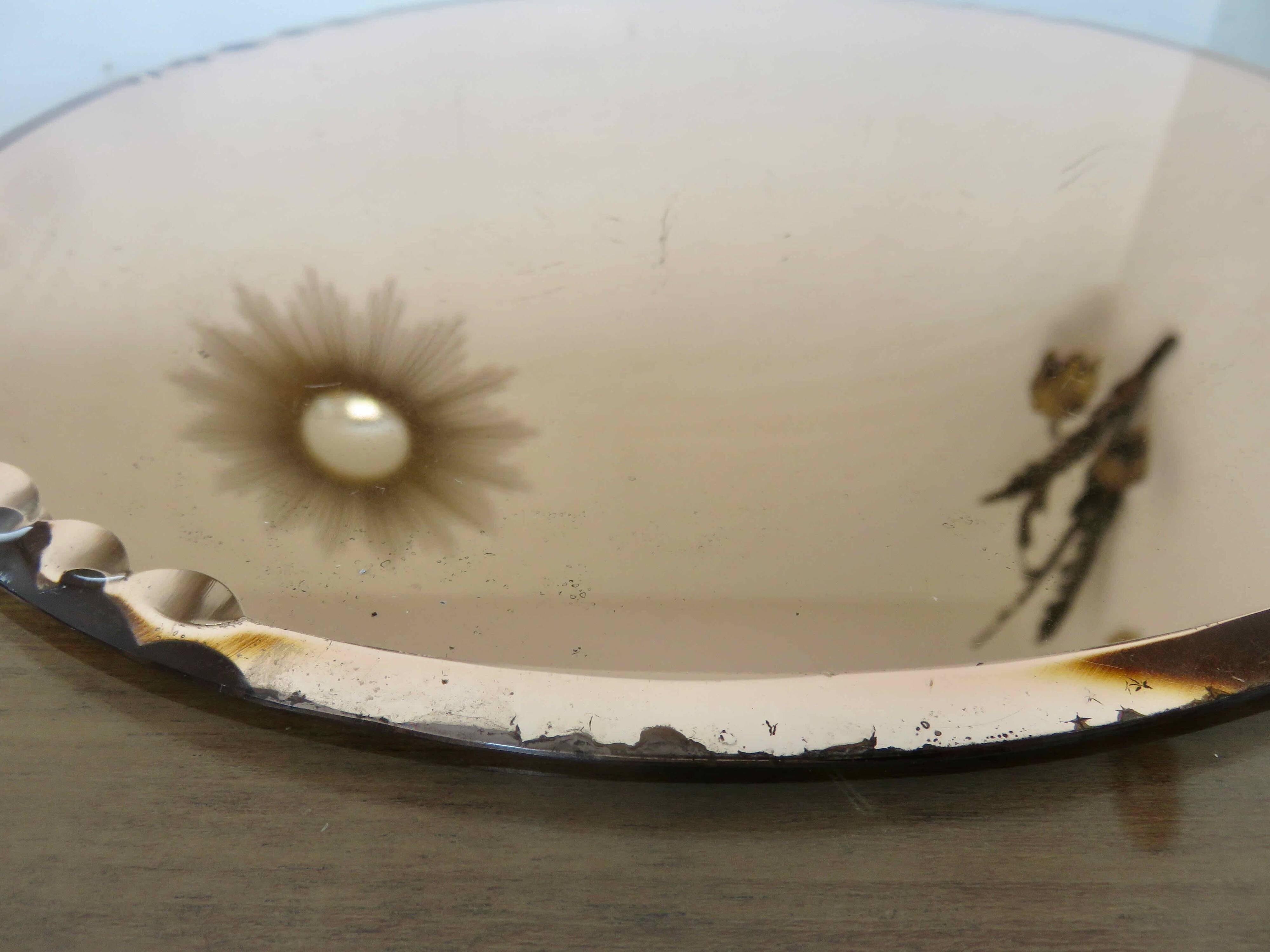 Round beveled amber pink mirror