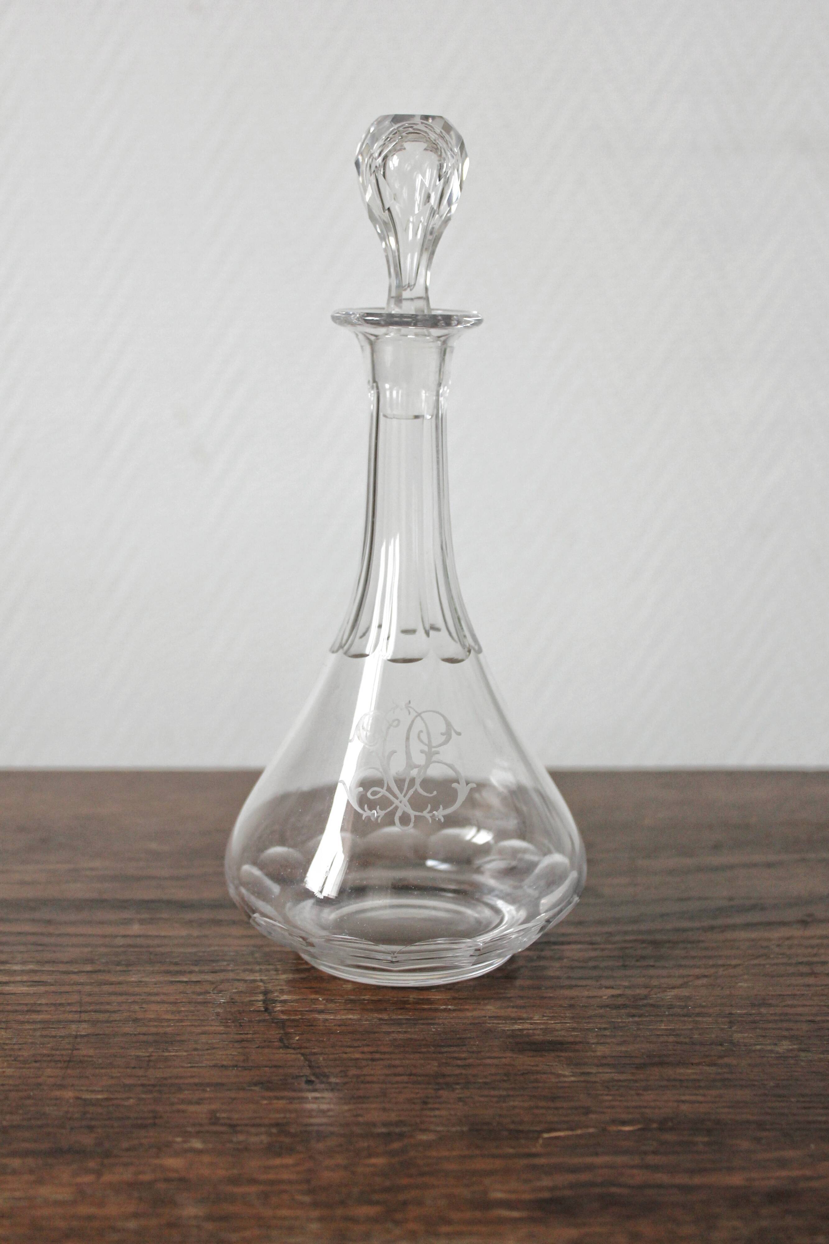 Antique crystal liqueur decanter with engraved monogram and flat ribs