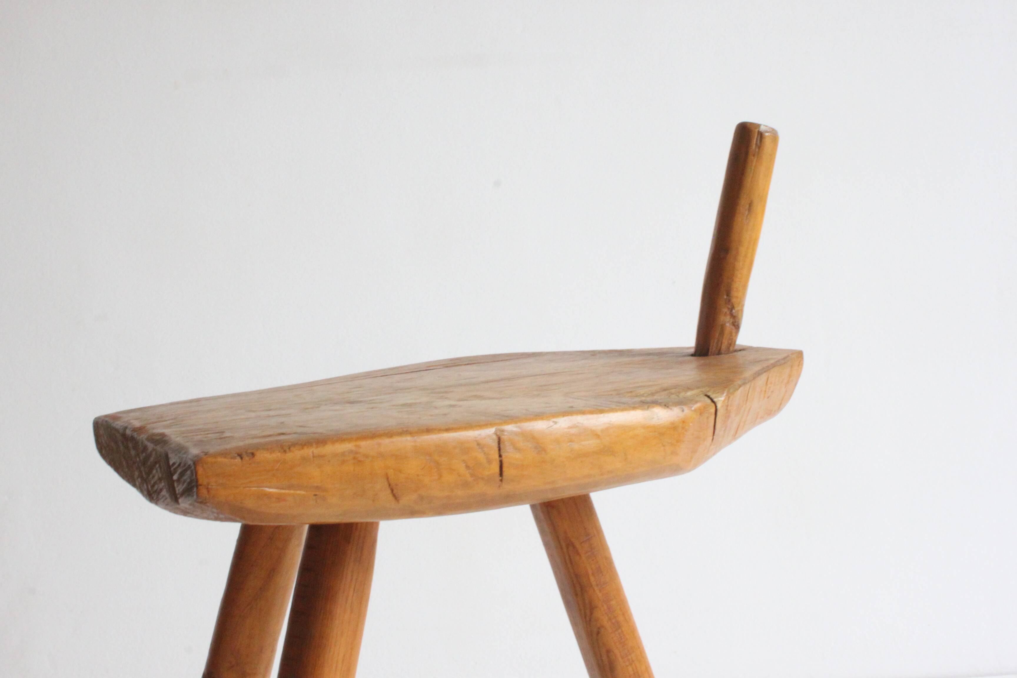 Brutalist tripod stool in carved wood, 1950s