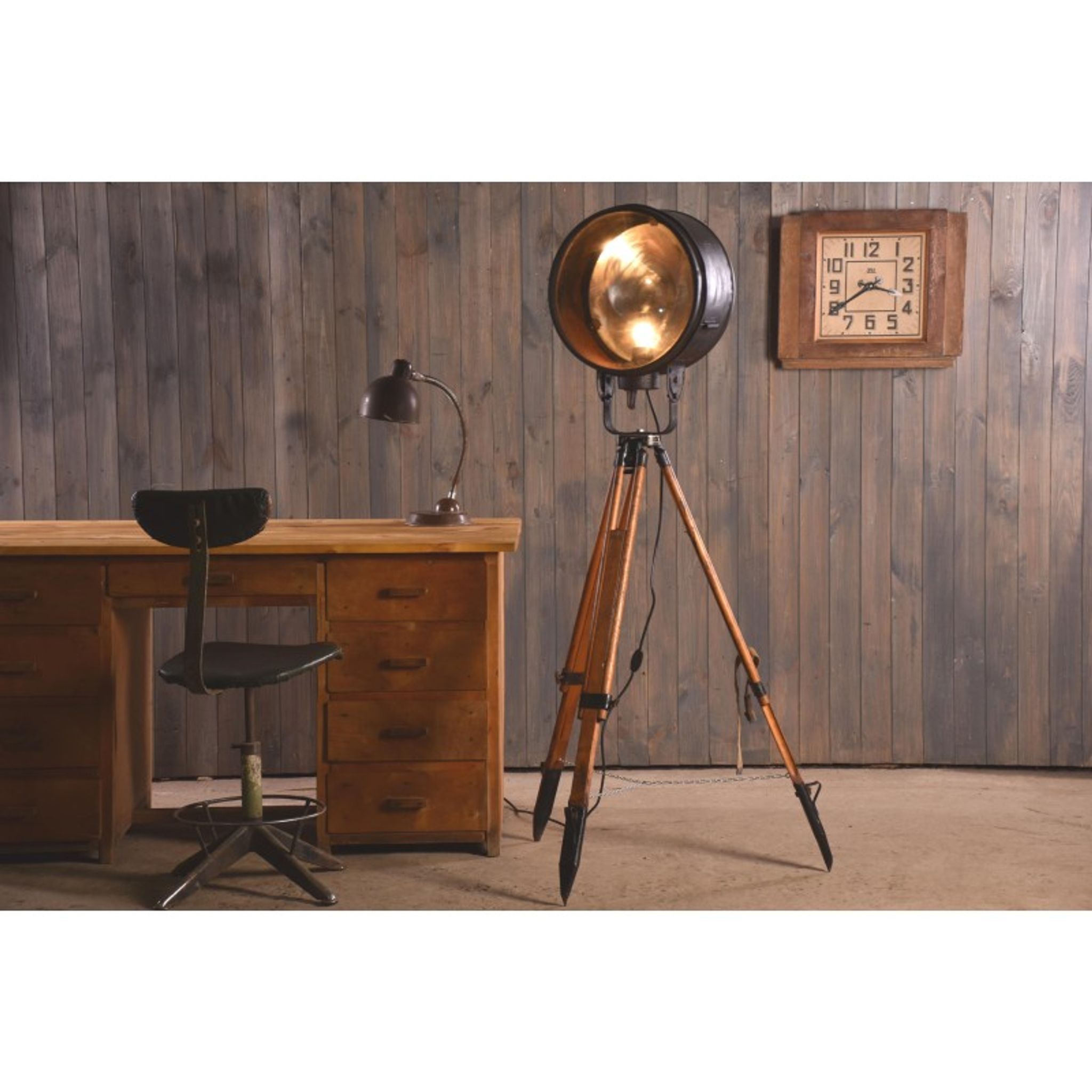 Old industrial spot on wooden tripod