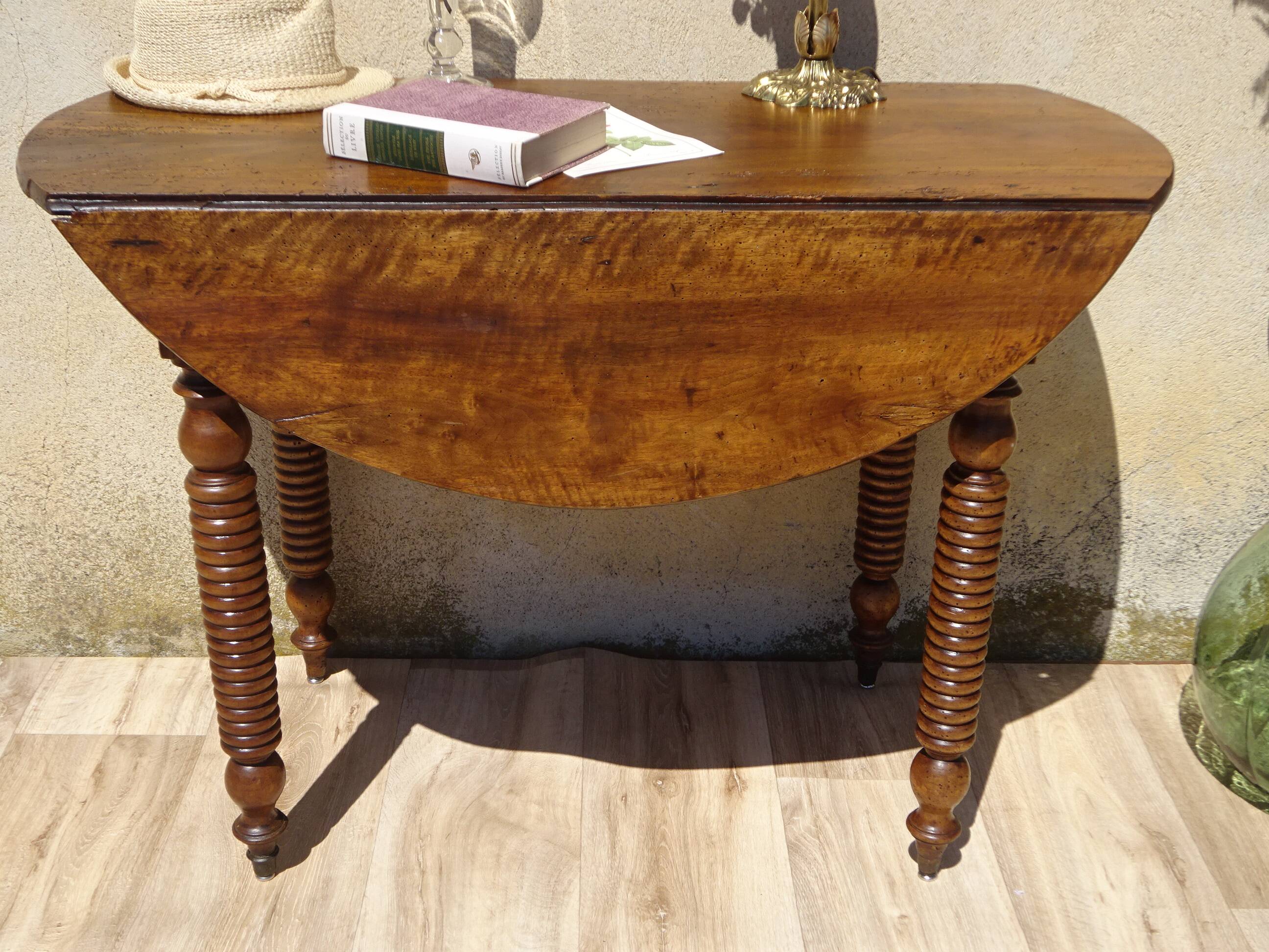 Antique walnut console table with honey spoon legs.