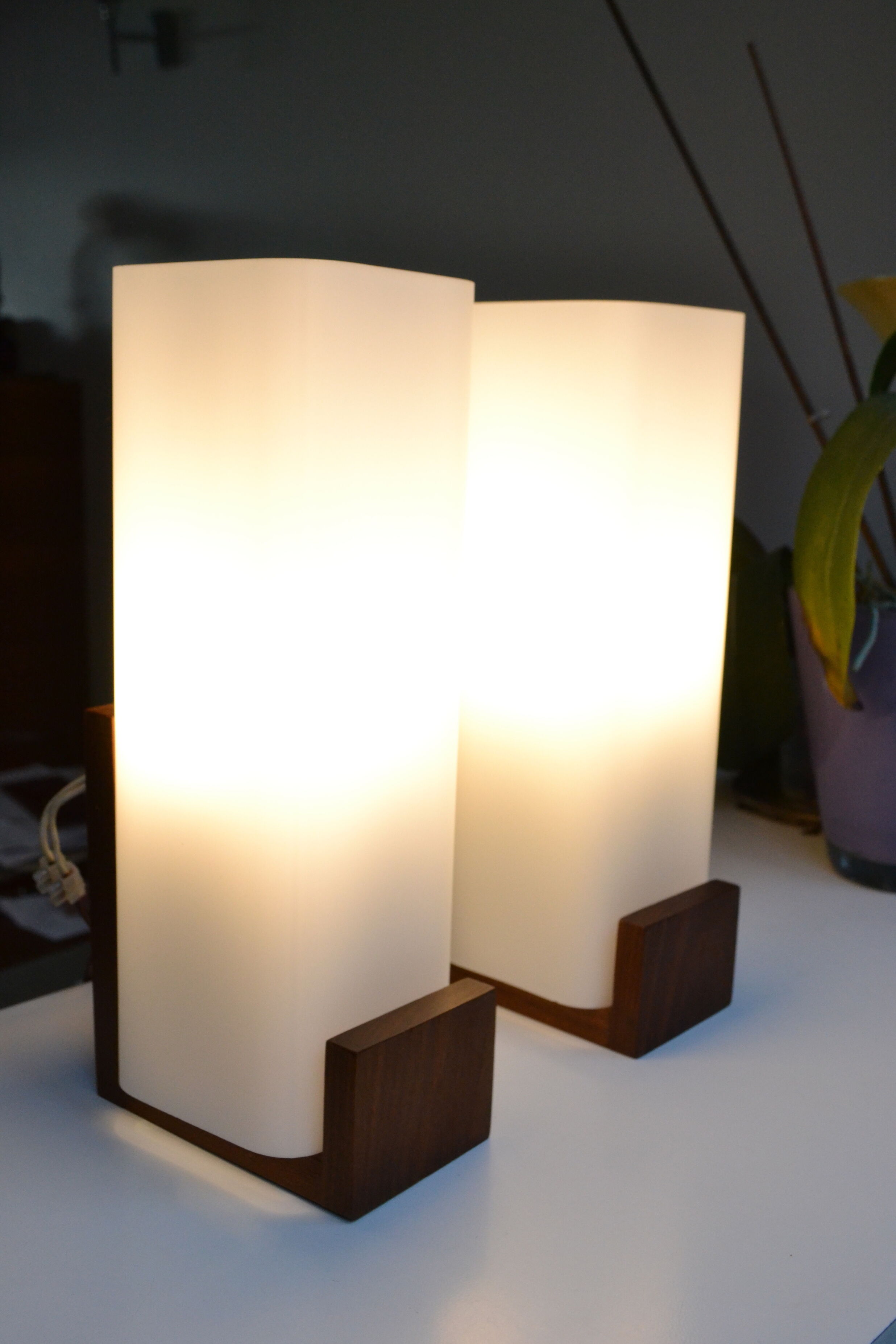 Pair of Louis Kalff opaline and teak wall lamps