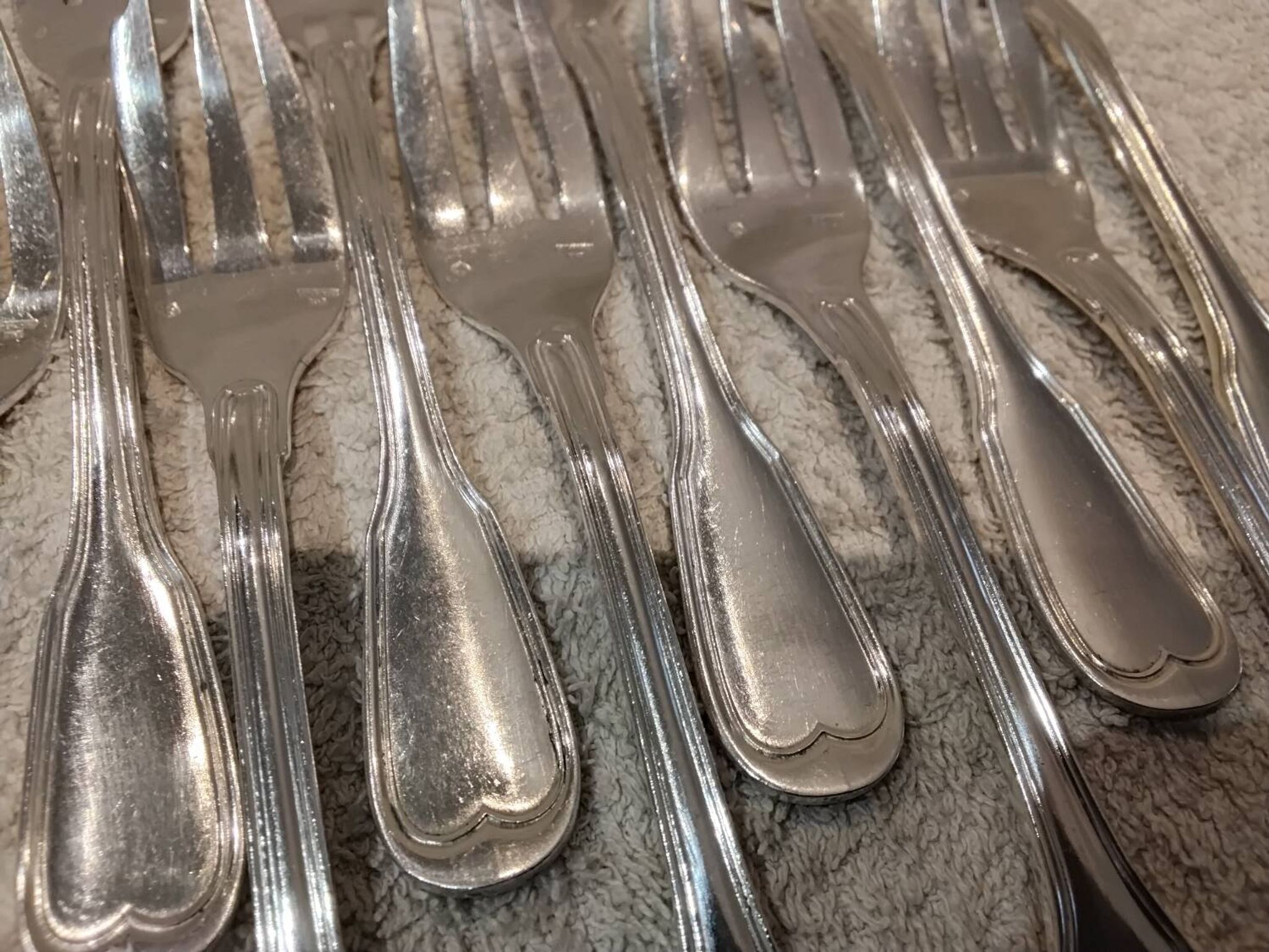 12 silver-plated metal cake forks by Argental silversmiths with a decorative pattern