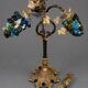 Decorative table lamp in the shape of coloured glass grape clusters.