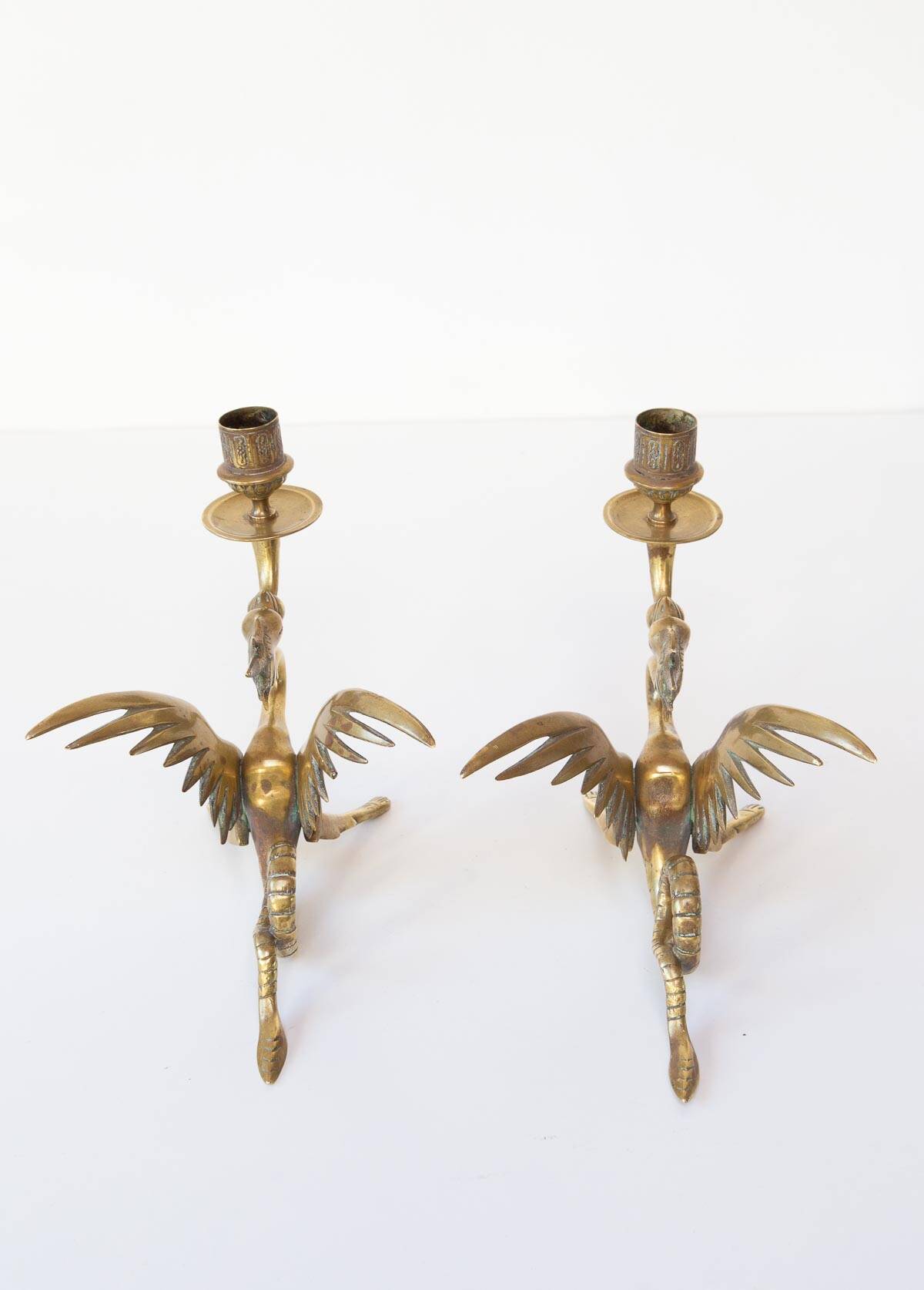 Pair of 19th century gilded brass “chimera” candlesticks