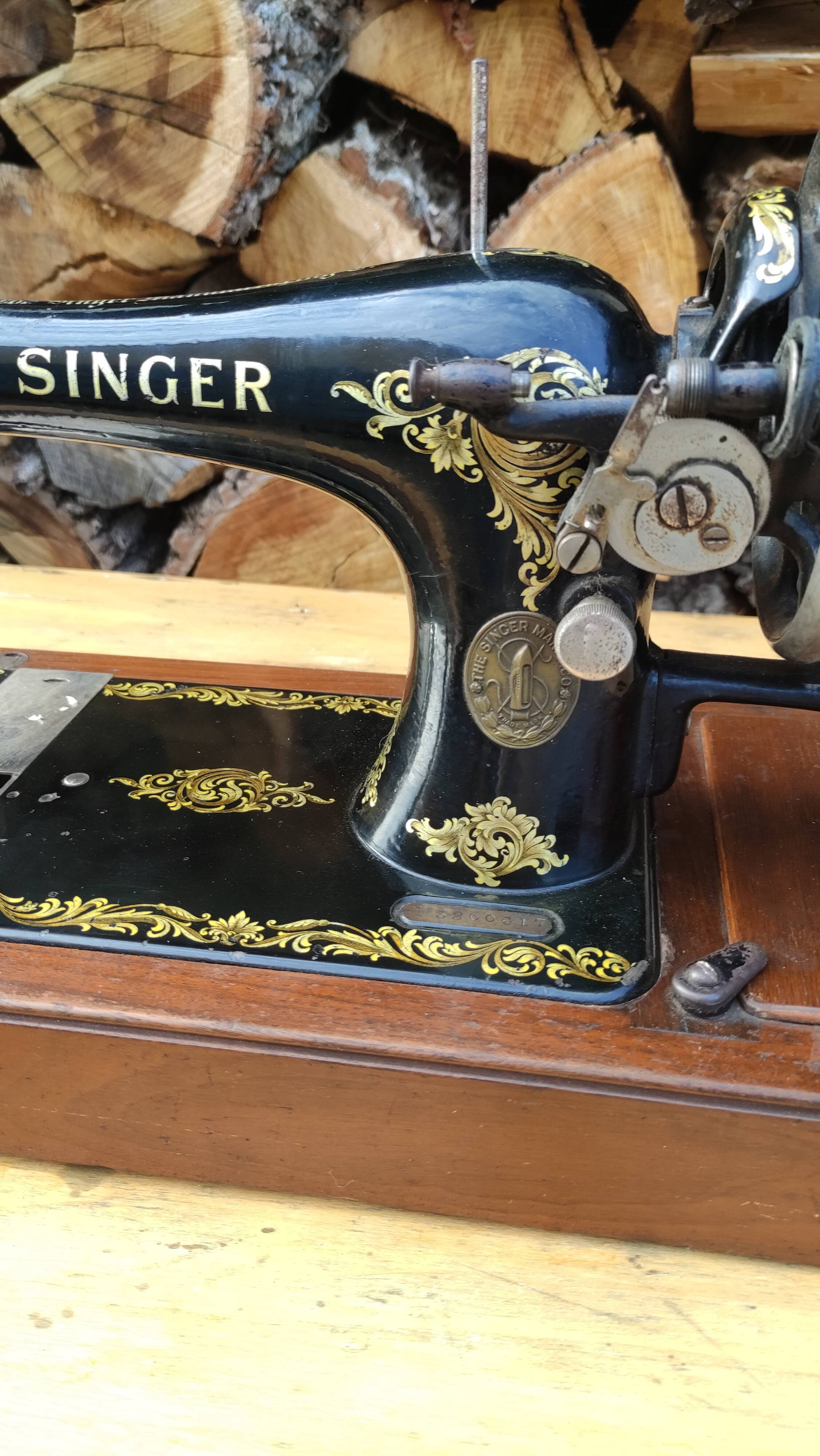 Old Singer sewing machine on its original base