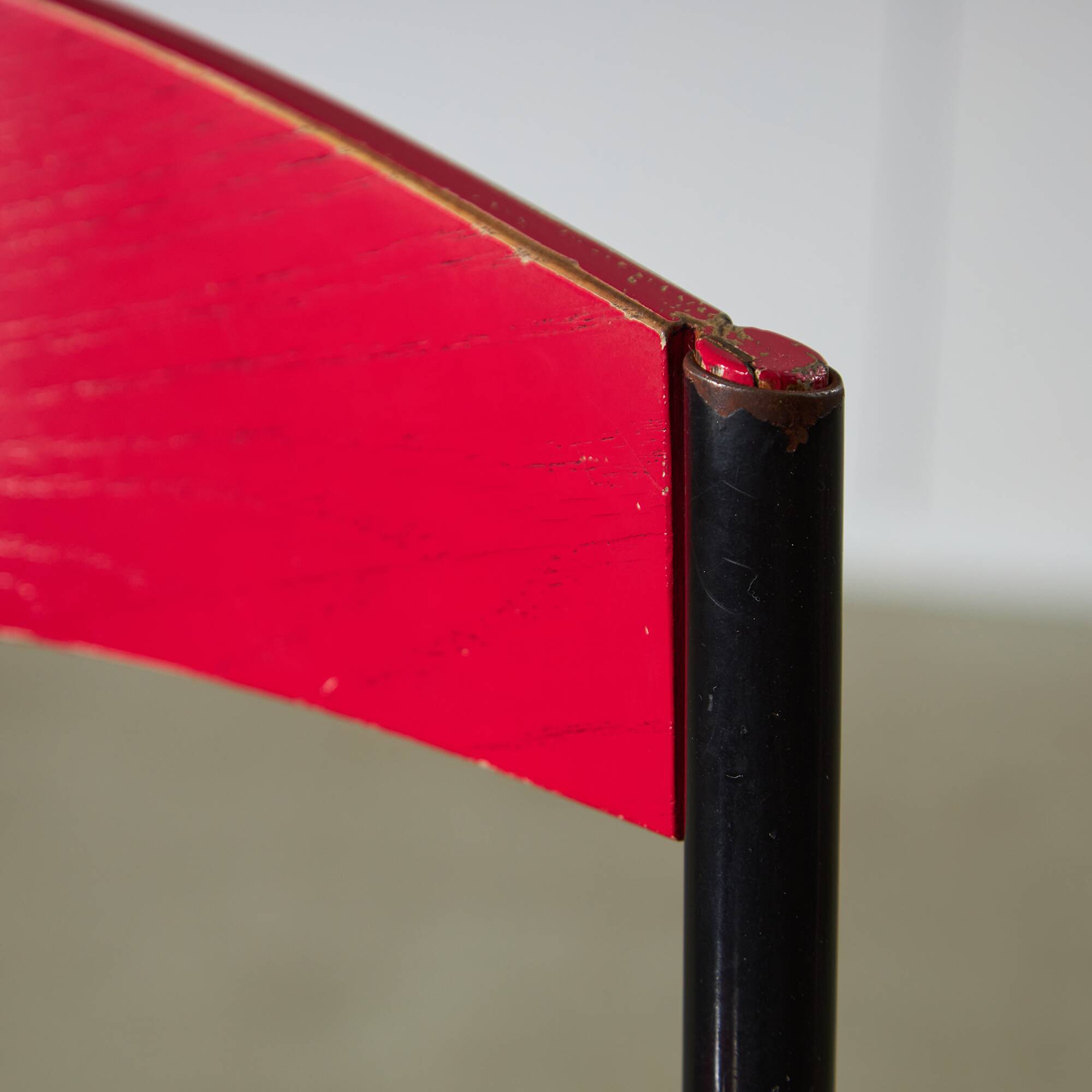 Red Plywood and Curved Metal Frame Chair
