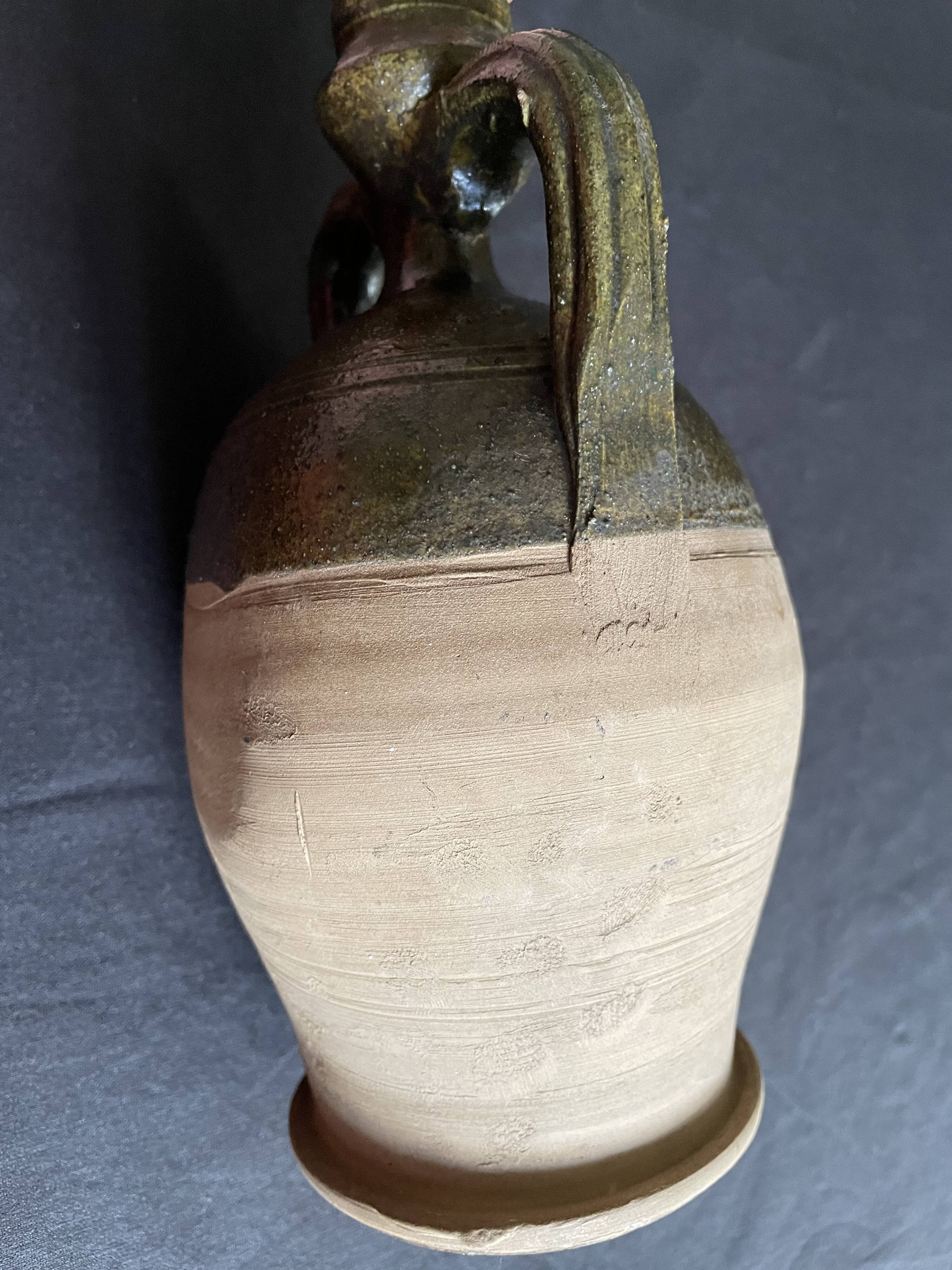 Persimmon glazed terracotta oil jar