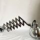 Vintage accordion wall light in chrome metal.