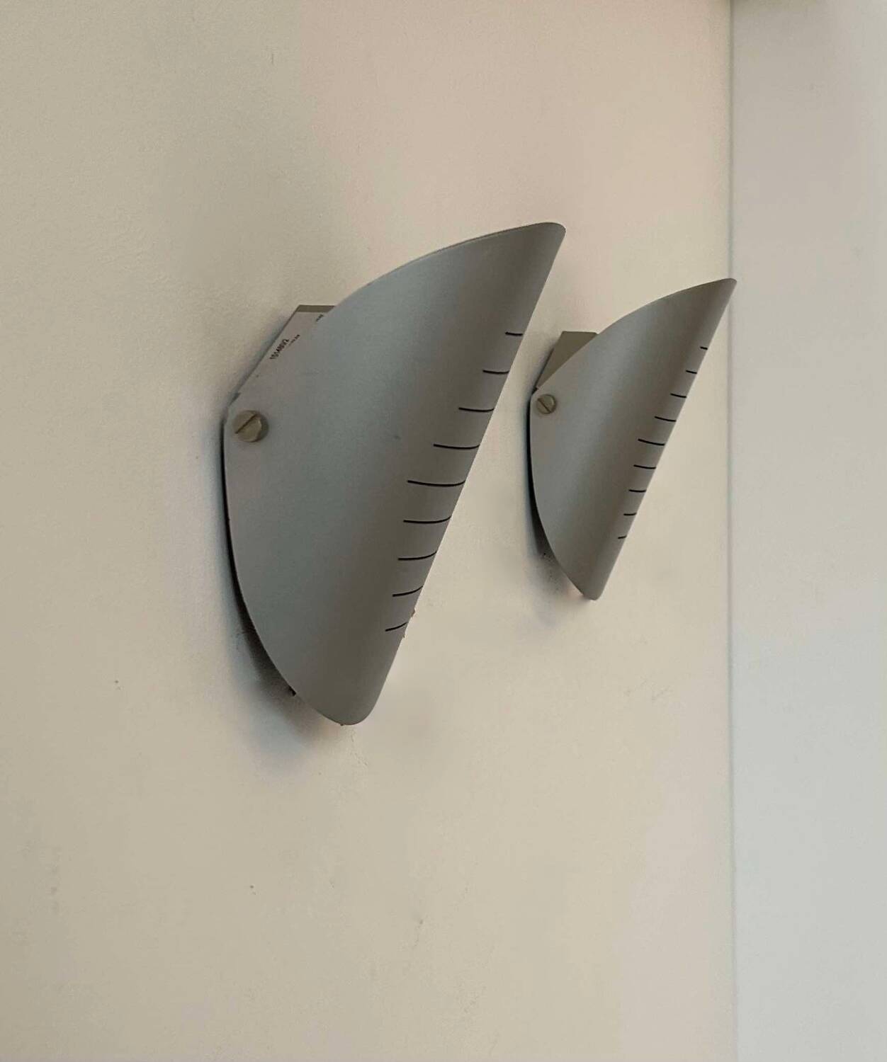 Pair of vintage adjustable wall lights, curved striated metal, France 1980