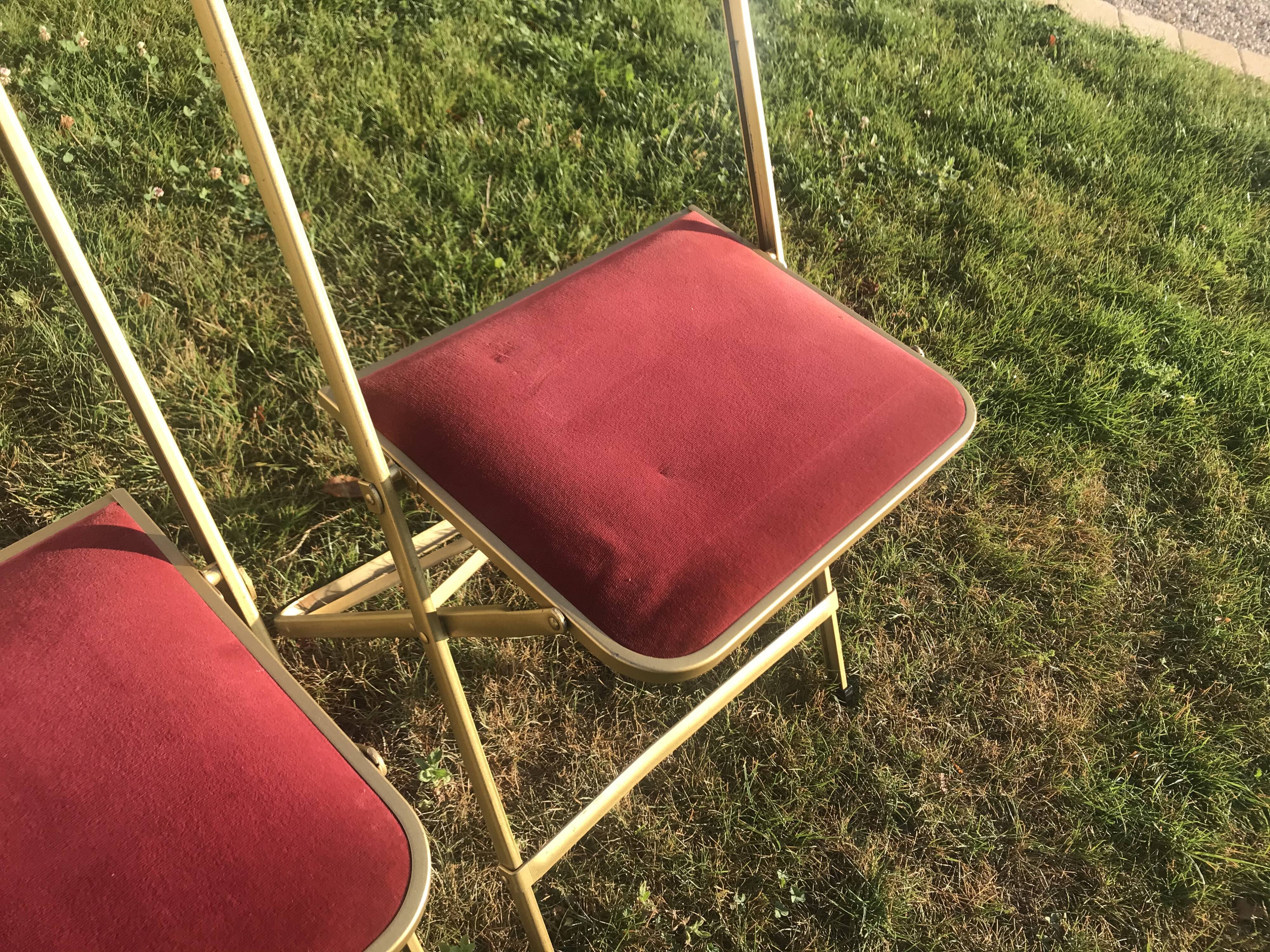 Pair of foldable red velvet chairs