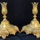 Pair of antique carved bronze candlesticks.