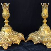 Pair of antique carved bronze candlesticks.